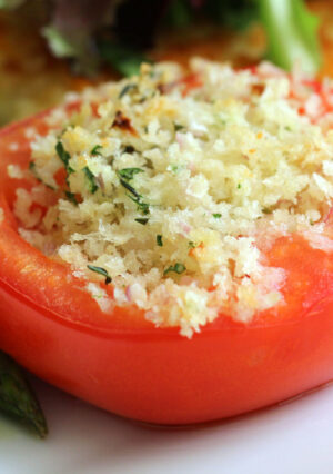 Baked tomato stuffed with seasoned bread crumbs