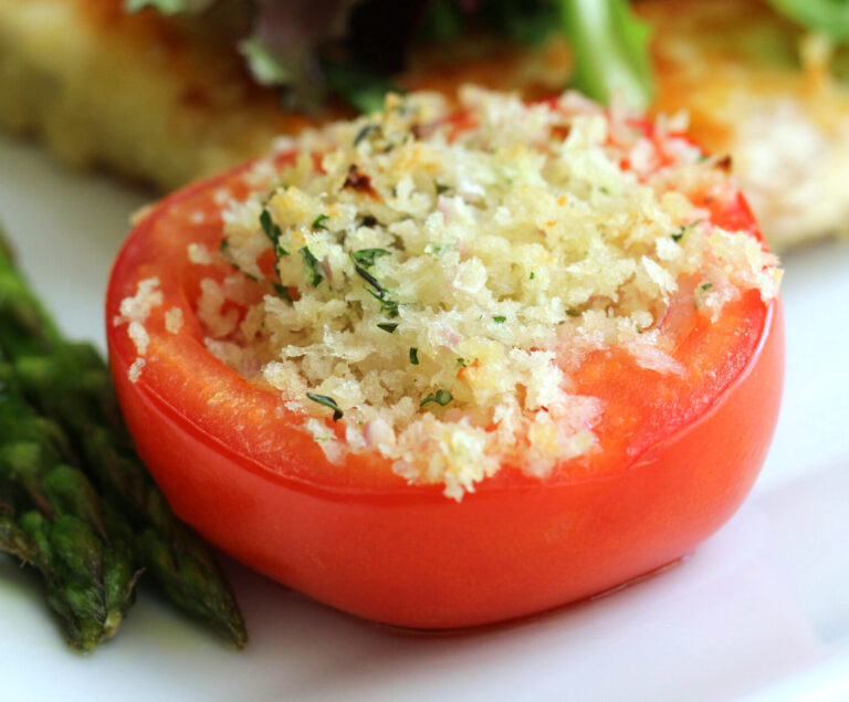 Baked tomato stuffed with seasoned bread crumbs